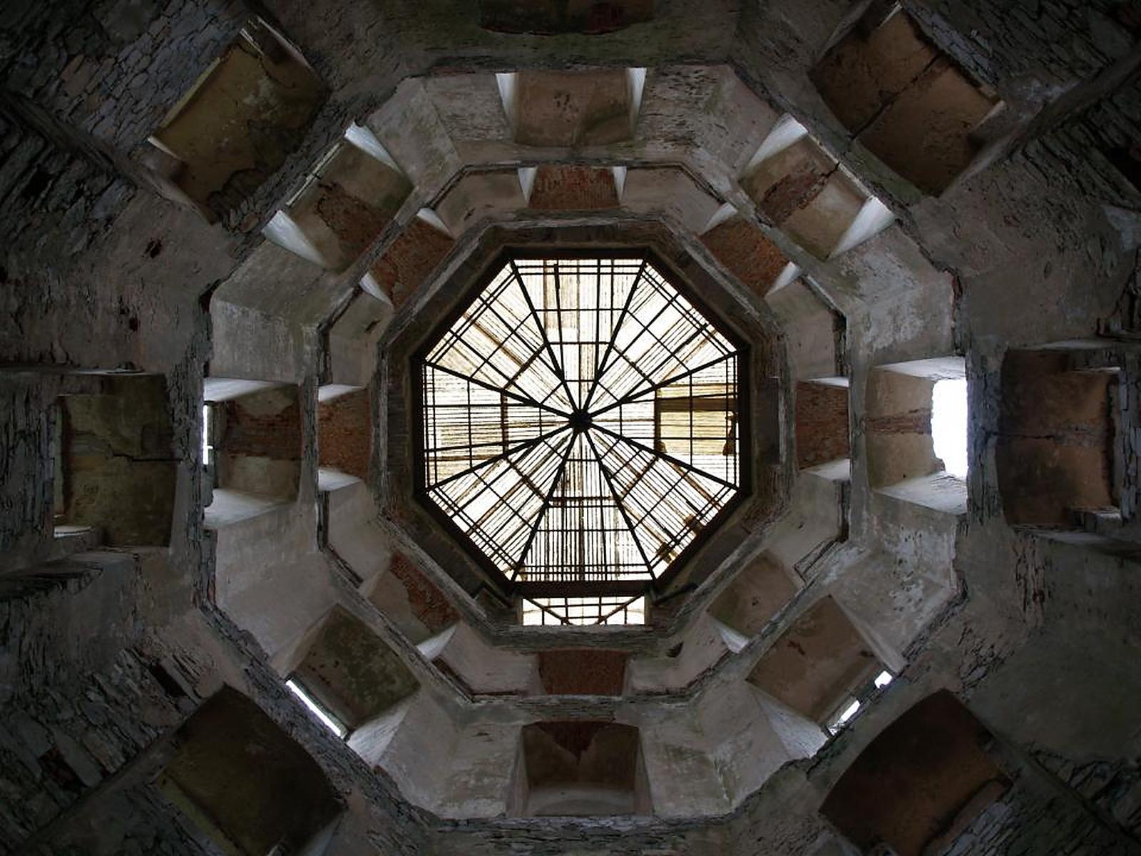 An ornate octagonal glass dome seen from below
